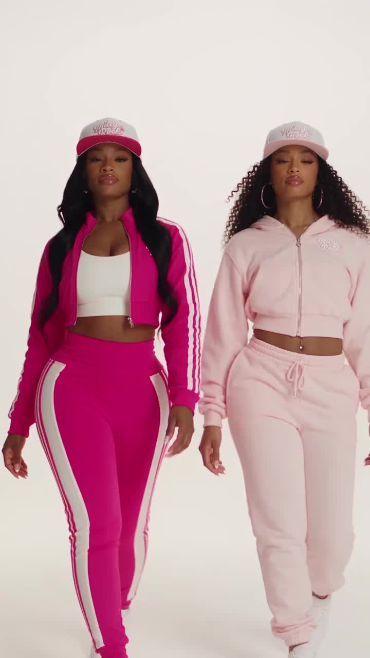 Two models showcasing pink streetwear outfits